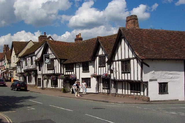 Traditional Tudor-style buildings along a street in Suffolk, UK.