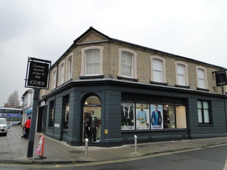 Suffolk Business clothing store on a street corner in Suffolk, UK.