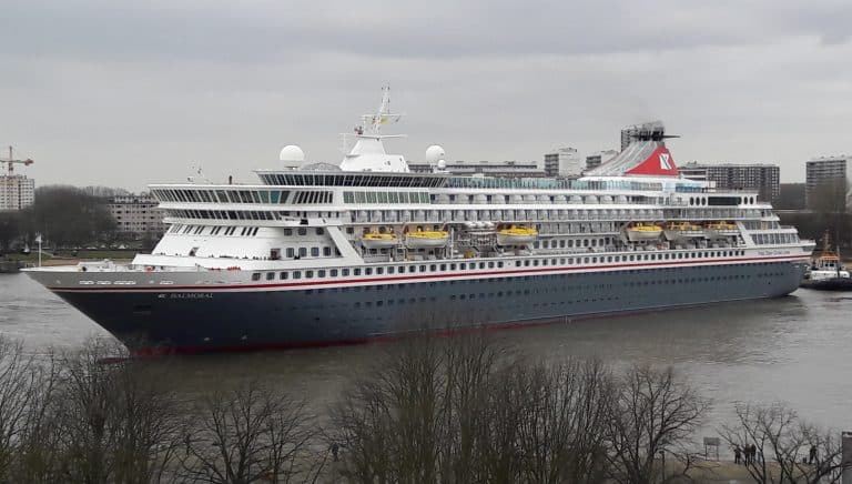 Luxury cruise ship docked on the river in Suffolk, showcasing maritime travel and tourism.