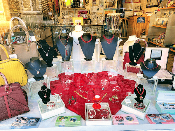 Elegant jewelry display featuring necklaces, bracelets, and accessories at Suffolk Business store. P.