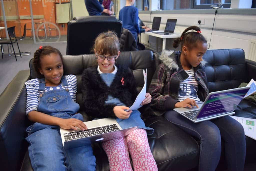 young people learning programming