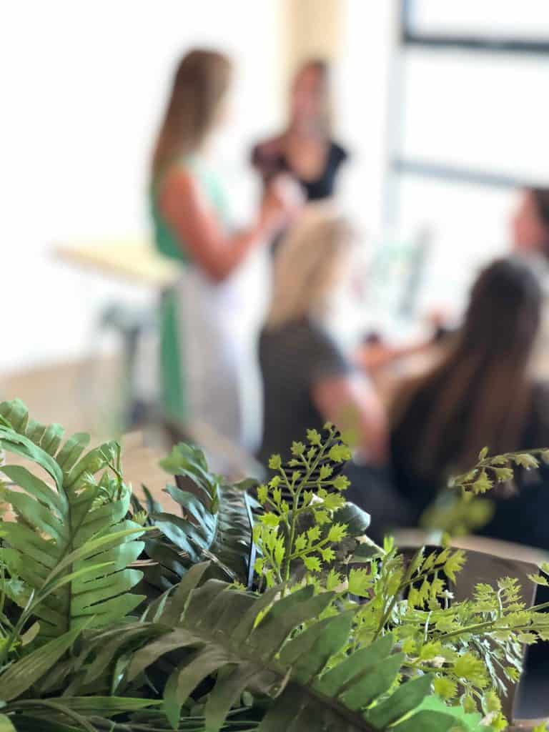Business meeting with team members discussing strategies in a contemporary office setting.