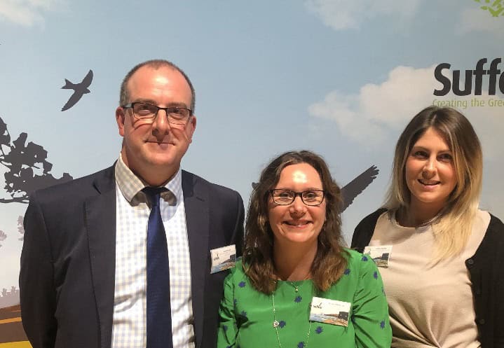 Suffolk Business event with professionals in a conference setting.