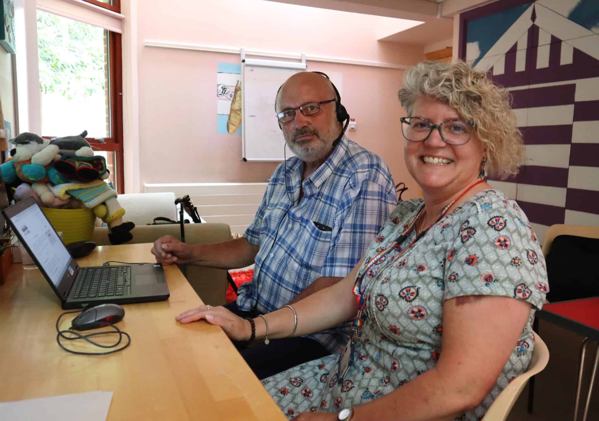 Two professionals working together at a Suffolk business office.
