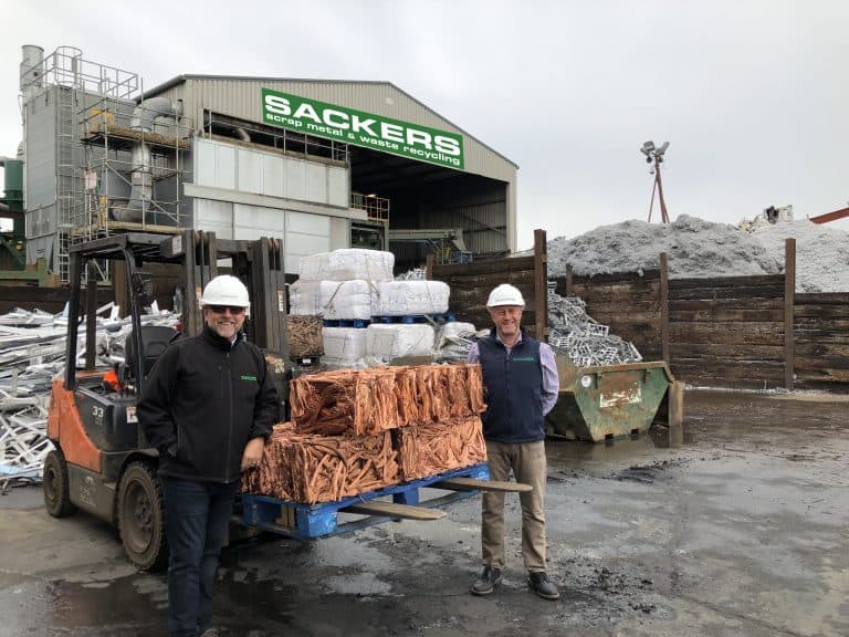 Suffolk Business waste recycling site with workers and forklift.