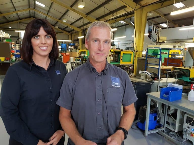 Manufacturing team in Suffolk factory with machinery and equipment.