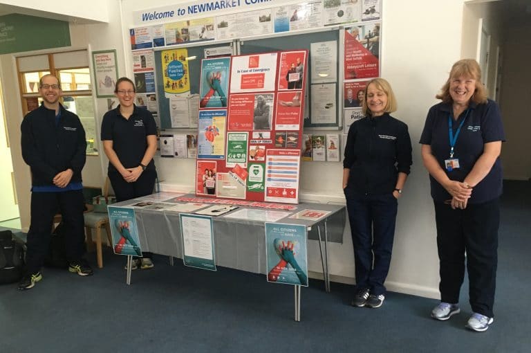 Suffolk Business exhibition with staff showcasing local business information.