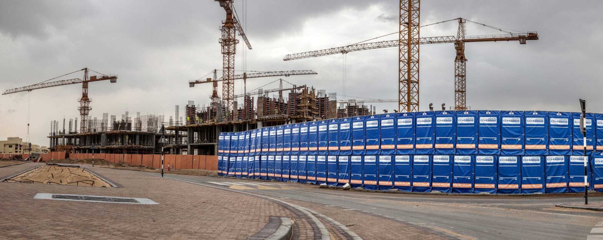 Construction site with multiple cranes and building framework in Suffolk, showcasing ongoing develop.