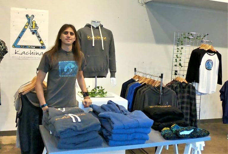 Suffolk Business clothing store showcasing hoodies and sweatshirts in a retail setting.