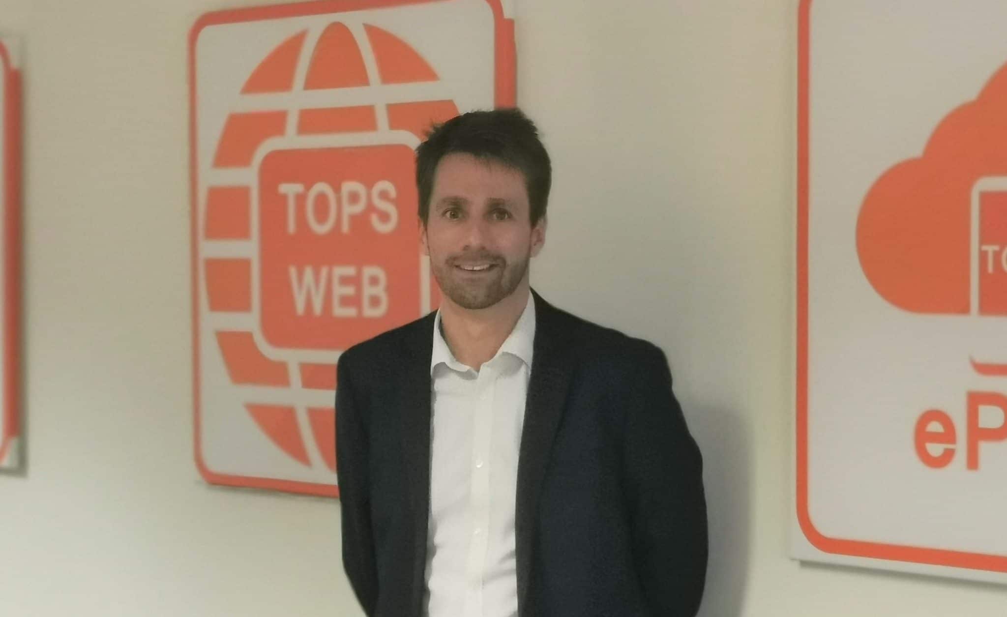 Business professional standing at Suffolk Business web conference event in Suffolk, UK.