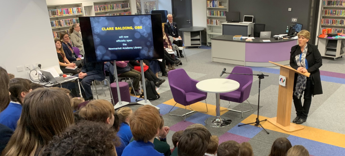 Author Clare Balding OBE speaking at Suffolk Library event with children and adults present.