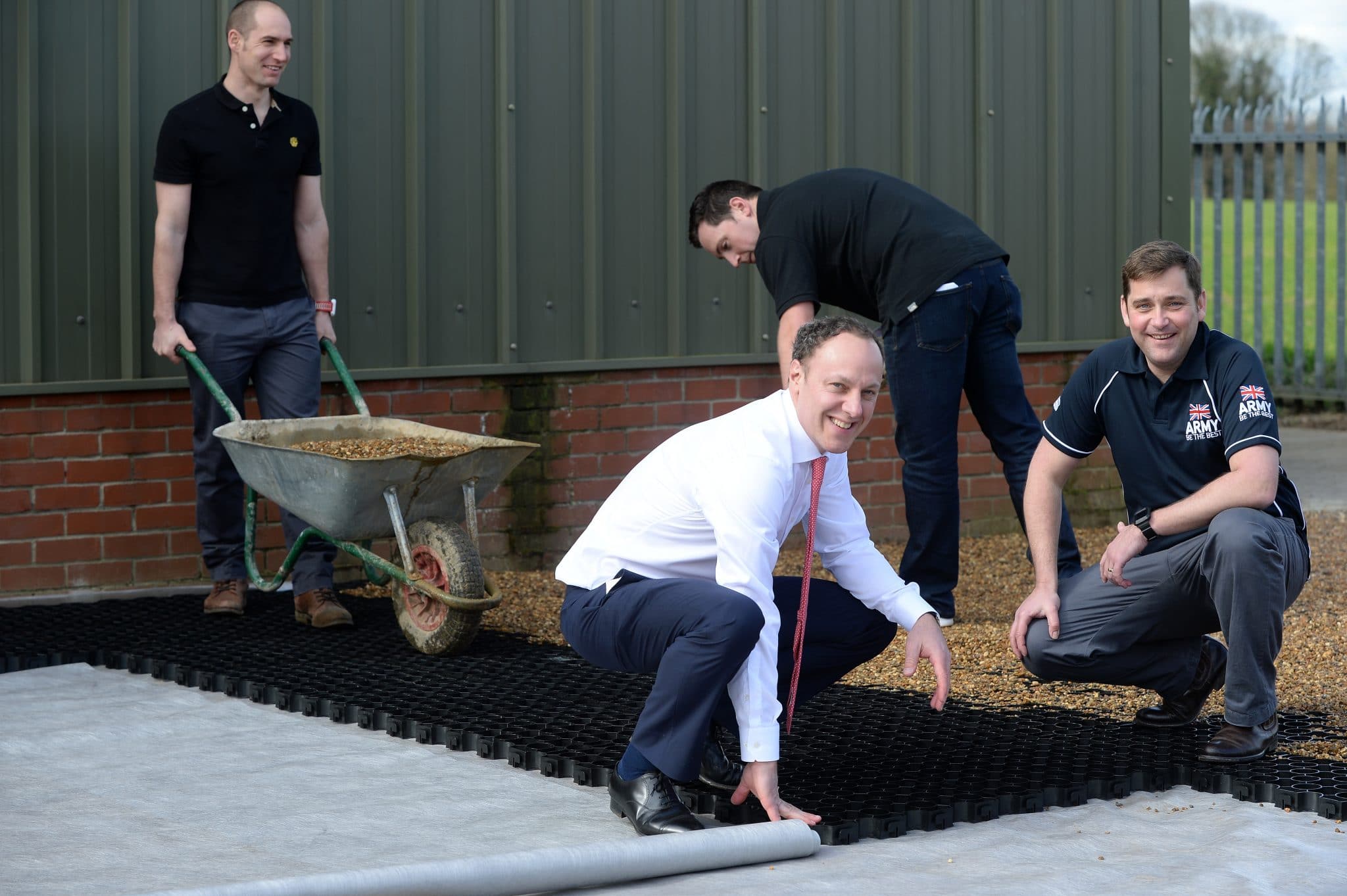 Construction workers installing outdoor flooring in Suffolk.