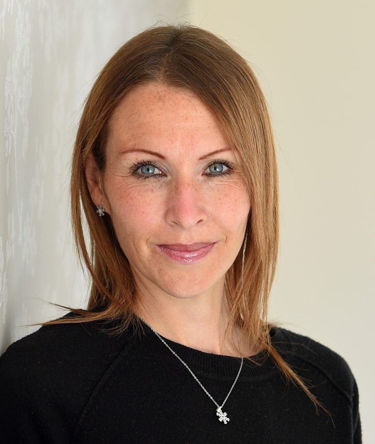 Portrait of a professional woman representing Suffolk Business sector.