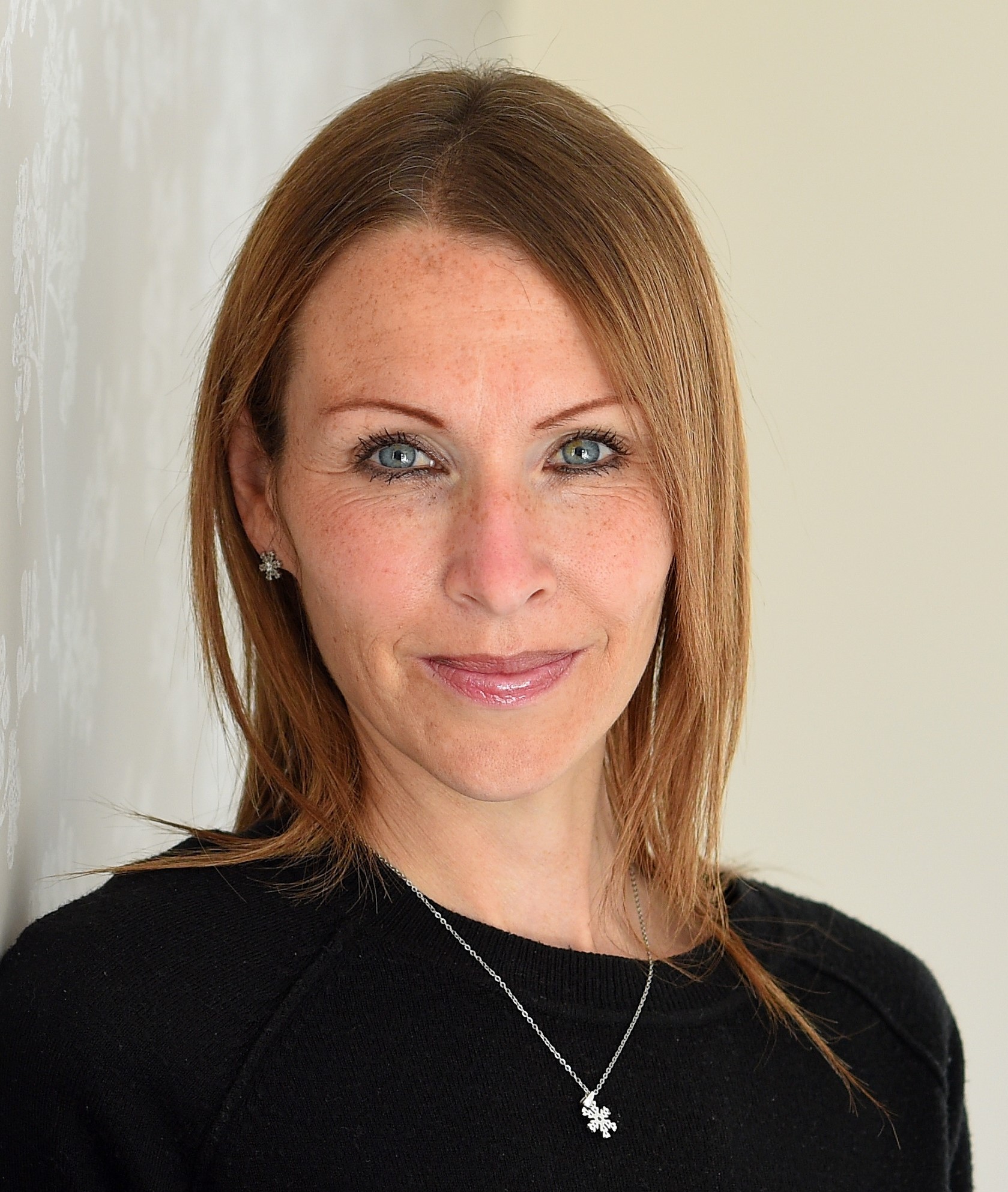 Portrait of a professional woman representing Suffolk Business sector.