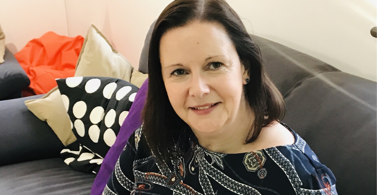 Suffolk Business woman smiling at a networking event in Suffolk.