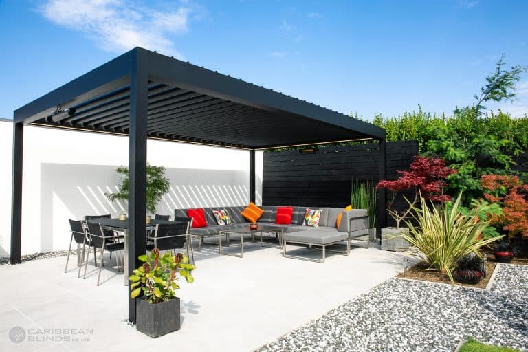 Contemporary outdoor patio with shaded seating and garden features in Suffolk.