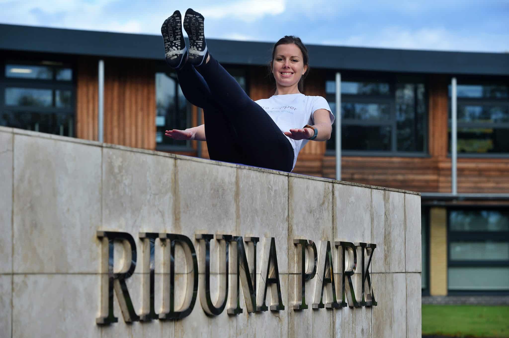 Woman enjoying outdoor fitness at Riduna Park, Suffolk Business centre.