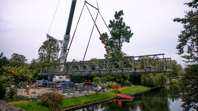 Bridge being assembled over a river in Suffolk.