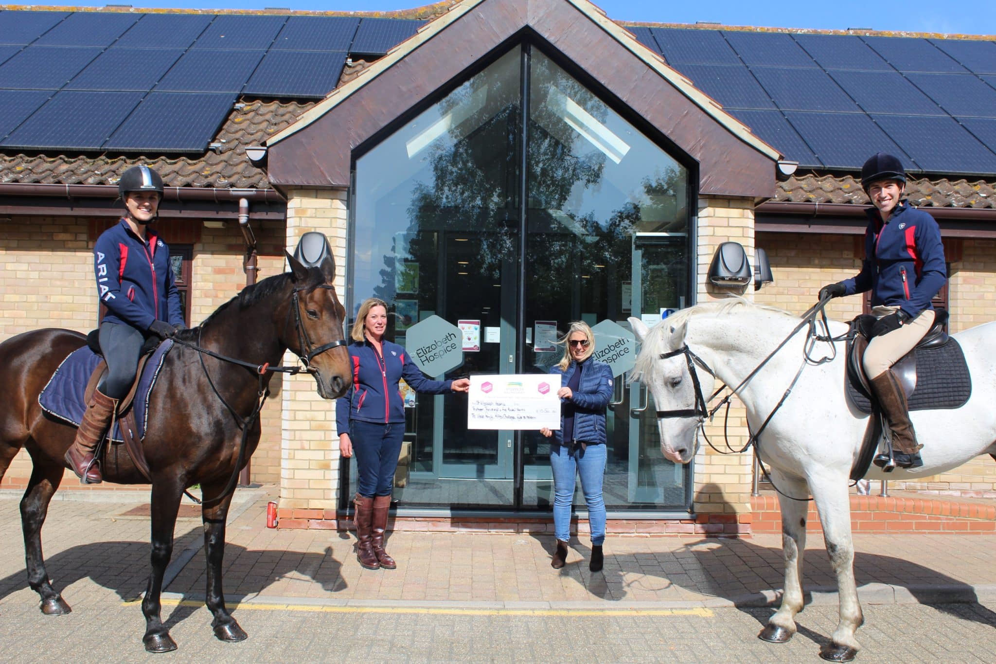 Business event with horse riders outside Suffolk Business centre.