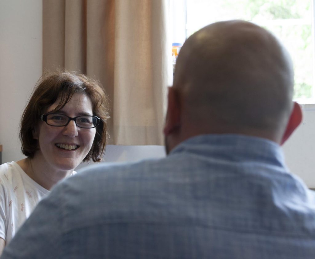 Business meeting with two professionals in a bright office setting.