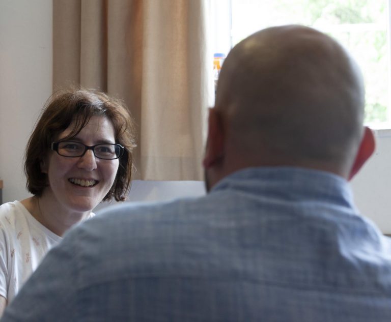 Business meeting with two professionals in a bright office setting.