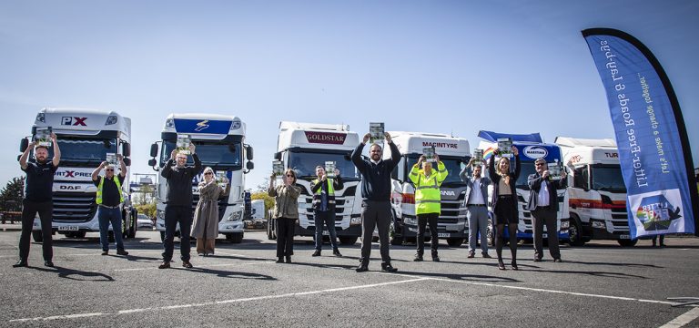 Suffolk Business emergency response team standing with trucks and personnel outdoors.