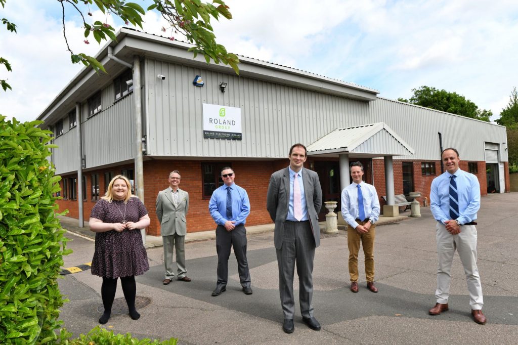 Suffolk Business team standing outside office building in Suffolk, UK.