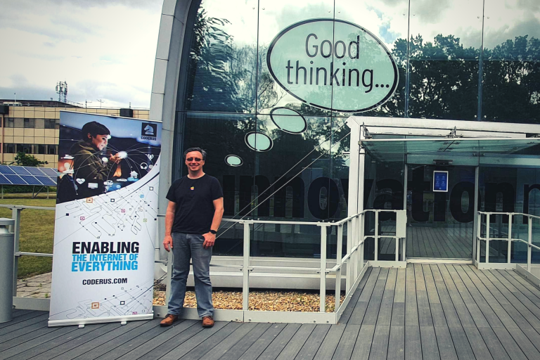 Modern Suffolk business centre with glass facade and motivational signage.