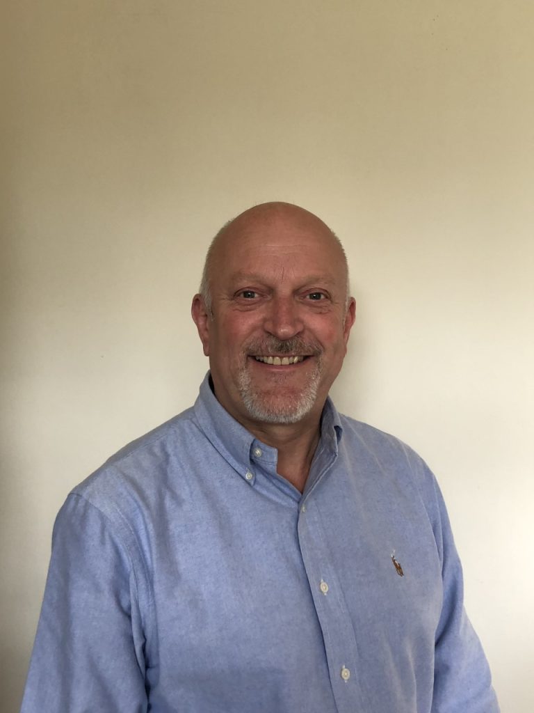 Professional businessman in Suffolk wearing a light blue shirt.
