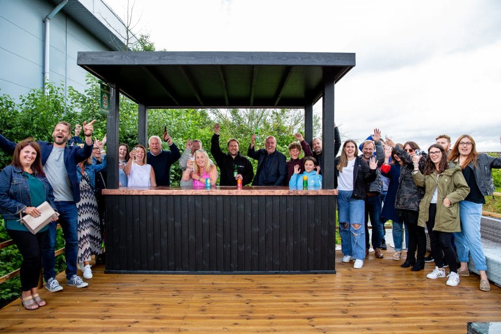 Group of professionals at Suffolk Business networking event outdoors.