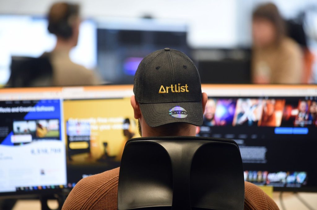 Person working at a computer in a modern office environment in Suffolk.