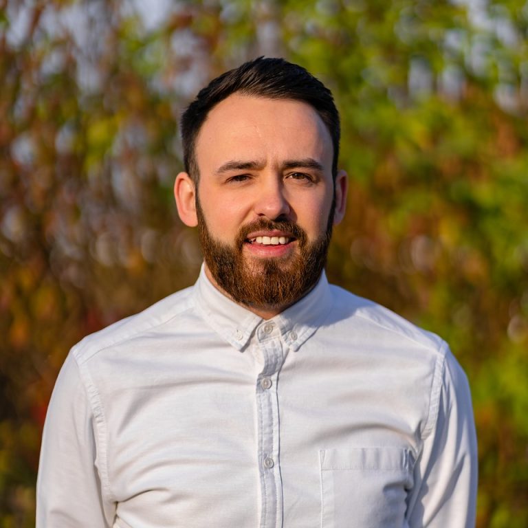 Professional portrait of a Suffolk business professional outdoors.