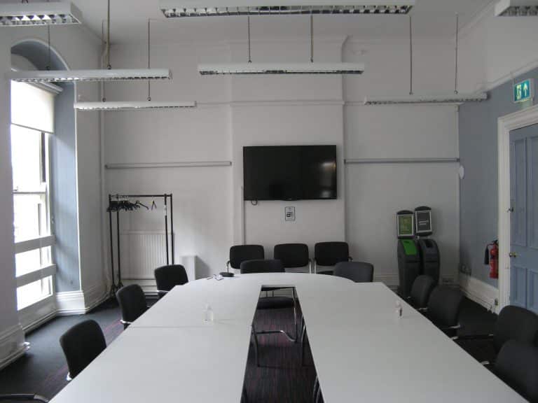 Contemporary Suffolk business meeting room with large table and chairs.