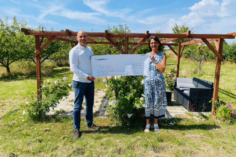 Director at Superstructures, Mark Hayward, presenting a cheque to Tina Prince at Talitha Koum. Credit Superstructures